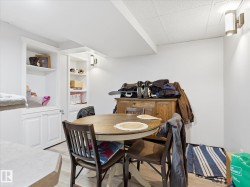 White built-in cabinetry with open shelving and lower storage - 