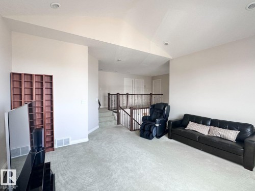 Loft space featuring neutral wall tones, recessed lighting, and light-toned carpeting - 820 Drysdale Run, Edmonton, AB - Indoor