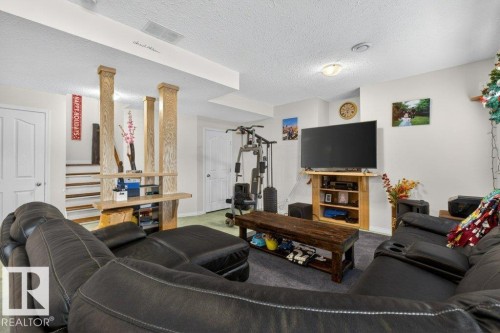 Spacious room with white walls, recessed lighting, and a textured ceiling - 16107 92 Street, Edmonton, AB - Indoor