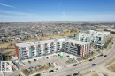 Modern multi-story residential building featuring a flat roof and multiple balconies - 318 1316 Windermere Way, Edmonton, AB  - Outdoor With View 