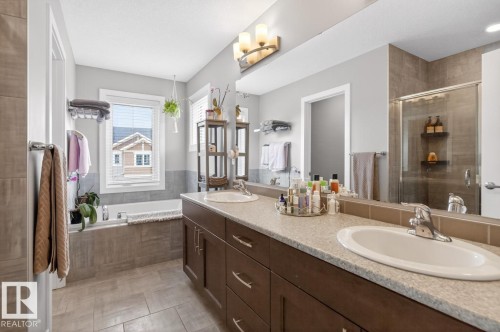 5 Piece Ensuite featuring Glass Shower, Large Soaker Tub, Double Vanity, and Separate Water Closet. Impressive Amounts of Storage and Counter Space. - 20023 17A Avenue, Edmonton, AB - Indoor Photo Showing Bathroom