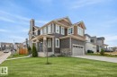 Exterior Front of Home featuring Double Garage, Corner Lot facing North West.  Extra Windows Throughout. - 20023 17A Avenue, Edmonton, AB  - Outdoor With Facade 