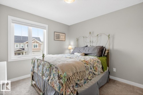 3rd Upstairs Bedroom featuring North Facing Window and ample space for a Queen Sized Bed plus Dresser. - 20023 17A Avenue, Edmonton, AB - Indoor Photo Showing Bedroom