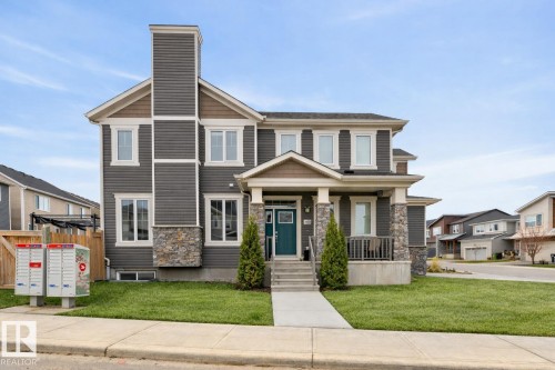 Exterior Front of Home featuring Double Garage, Corner Lot facing North West.  Extra Windows Throughout. - 20023 17A Avenue, Edmonton, AB - Outdoor With Facade