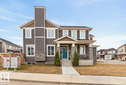 Exterior Front of Home featuring Double Garage, Corner Lot facing North West. - 20023 17A Avenue, Edmonton, AB - Outdoor With Facade
