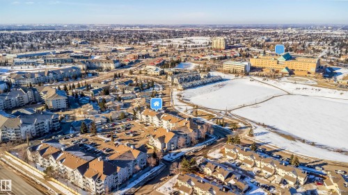 Aerial perspective showcasing a developed urban area with varied residential and commercial structures - 213 5065 31 Avenue, Edmonton, AB - Outdoor With View