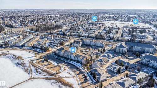 Aerial perspective showcasing a residential development within a larger community - 213 5065 31 Avenue, Edmonton, AB - Outdoor With View