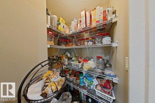 Corner pantry featuring wire shelving providing extensive storage capacity - 1206 Mckinney Court, Edmonton, AB - Indoor