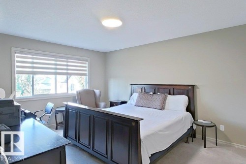 Expansive bedroom featuring neutral wall tones and carpeted flooring - 1206 Mckinney Court, Edmonton, AB - Indoor Photo Showing Bedroom