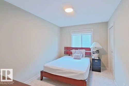 Bedroom with neutral wall paint and light-colored carpet flooring - 1206 Mckinney Court, Edmonton, AB - Indoor Photo Showing Bedroom
