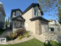 Two-story home with a tan siding exterior and dark trim - 1206 Mckinney Court, Edmonton, AB  - Outdoor 