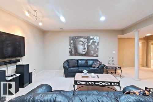 Spacious living area featuring neutral wall tones, crown molding, and recessed lighting - 1206 Mckinney Court, Edmonton, AB - Indoor Photo Showing Living Room