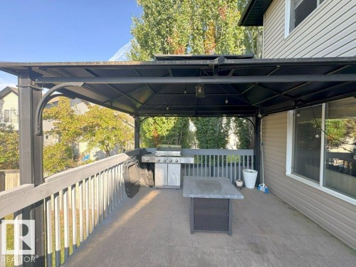 Expansive outdoor deck featuring a dark grey railing and a black metal gazebo structure - 1206 Mckinney Court, Edmonton, AB - Outdoor With Deck Patio Veranda With Exterior