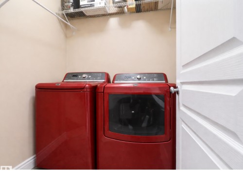 Dedicated laundry area featuring wire shelving for storage - 3243 26 Street, Edmonton, AB - Indoor Photo Showing Laundry Room