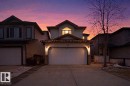 The property features a two-car garage with overhead lighting and a paved driveway - 3243 26 Street, Edmonton, AB  - Outdoor 