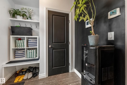 Entryway featuring built-in shelving, coat hooks, and a bench - 8131 Chappelle Way, Edmonton, AB - Indoor Photo Showing Other Room