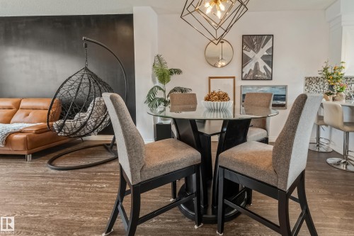 Open concept interior featuring wood-finish flooring - 8131 Chappelle Way, Edmonton, AB - Indoor Photo Showing Dining Room