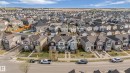 Aerial perspective of a developed residential area featuring multiple single-family homes with diverse architectural styles, asphalt shingle roofs, and paved driveways - 8131 Chappelle Way, Edmonton, AB  - Outdoor With View 