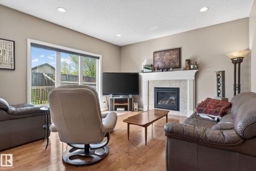 9 Woodbridge Link, Fort Saskatchewan, AB - Indoor Photo Showing Living Room With Fireplace