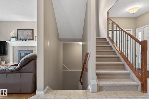 9 Woodbridge Link, Fort Saskatchewan, AB - Indoor Photo Showing Other Room With Fireplace