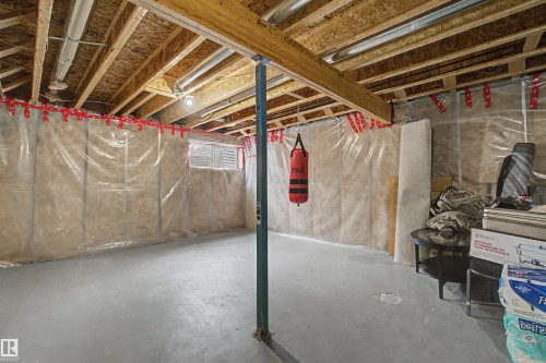 Unfinished lower level featuring exposed wood joists and subflooring, insulated walls with vapor barrier, and a concrete floor - 1602 Chapman Way, Edmonton, AB - Indoor Photo Showing Basement