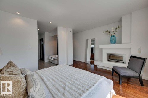 14A Birch Drive, St. Albert, AB - Indoor Photo Showing Bedroom With Fireplace