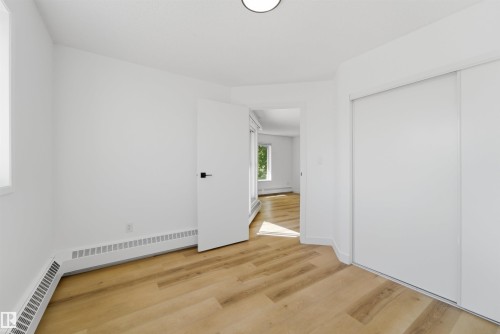 Room with light wood-finish flooring, white walls, and a white ceiling - 302 2508 50 Street Nw, Edmonton, AB - Indoor Photo Showing Other Room