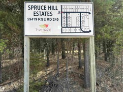 Spruce Hill Estates directional sign featuring a lot map and property address - 