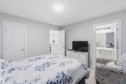 Carpeted room with light grey walls and white trim - 5129 Lark Crescent, Edmonton, AB - Indoor Photo Showing Bedroom