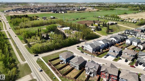 Aerial perspective showcasing a residential development with varied architectural styles - 5129 Lark Crescent, Edmonton, AB - Outdoor With View