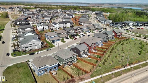 Aerial perspective showcasing a residential community with multiple detached homes - 5129 Lark Crescent, Edmonton, AB - Outdoor With View