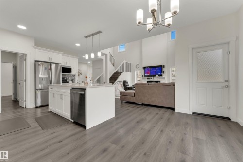 Open-concept living space with wood-finish flooring - 22534 98A Avenue, Edmonton, AB - Indoor Photo Showing Kitchen