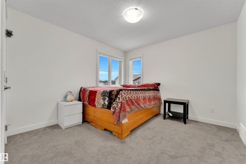 Carpeted room featuring bright white walls, baseboards, and trim - 22534 98A Avenue, Edmonton, AB - Indoor Photo Showing Bedroom
