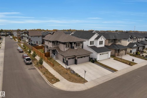 Modern two-story residence featuring a dark gray and beige exterior with crisp white trim accents - 22534 98A Avenue, Edmonton, AB - Outdoor