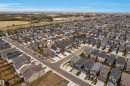 Residential neighborhood featuring a mix of modern homes with varying rooflines and exterior finishes - 22534 98A Avenue, Edmonton, AB  - Outdoor With View 