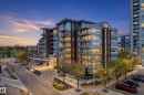 Contemporary multi-story building featuring extensive glazing, private balconies, and a covered entry drive - 808 2612 109 Street, Edmonton, AB  - Outdoor 
