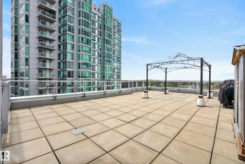 Expansive rooftop terrace featuring large square pavers and a metal gazebo frame - 808 2612 109 Street, Edmonton, AB - Outdoor