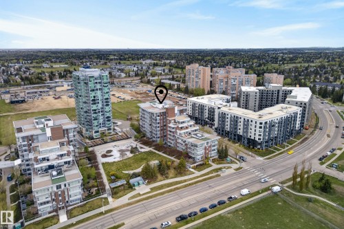 Modern high-rise residential building featuring a distinct stepped architectural design and multiple private balconies - 808 2612 109 Street, Edmonton, AB - Outdoor With View