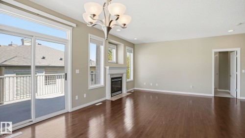 28 1251 Rutherford Road, Edmonton, AB - Indoor Photo Showing Other Room With Fireplace