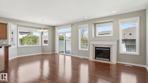 28 1251 Rutherford Road, Edmonton, AB - Indoor Photo Showing Living Room With Fireplace