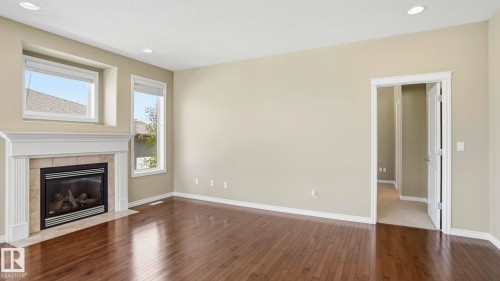 28 1251 Rutherford Road, Edmonton, AB - Indoor Photo Showing Living Room With Fireplace