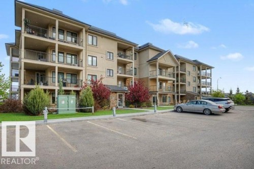 Four-story residential building with private balconies and exterior stone accents - 209 1029 173 Stnw, Edmonton, AB - Outdoor With Balcony With Facade