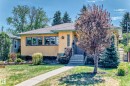 Stucco exterior with stone accents and a covered entryway - 11309 115 Street, Edmonton, AB  - Outdoor 