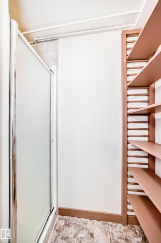 Enclosed shower with frosted glass panels and chrome framing - 11309 115 Street, Edmonton, AB - Indoor