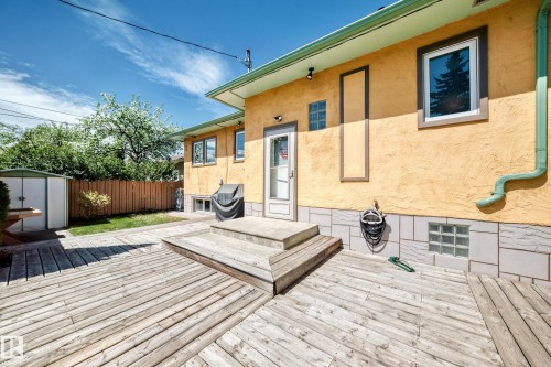 Expansive wood-finish deck with integrated steps - 11309 115 Street, Edmonton, AB - Outdoor With Deck Patio Veranda With Exterior