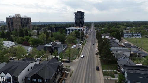 Aerial perspective showcasing a tree-lined thoroughfare with various residential and commercial structures - 14039 104 Avenue Nw, Edmonton, AB 