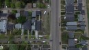 Aerial perspective showcasing a residential street with multiple properties featuring dark-toned roofs and varying lot sizes - 14039 104 Avenue Nw, Edmonton, AB 