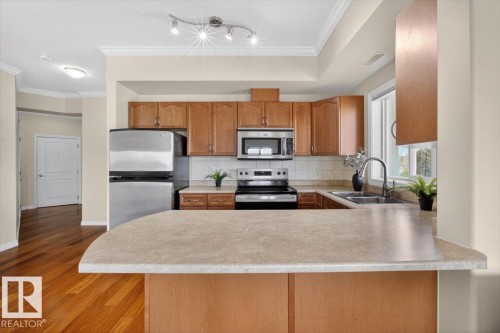 326 8528 82 Avenue, Edmonton, AB - Indoor Photo Showing Kitchen With Stainless Steel Kitchen With Double Sink