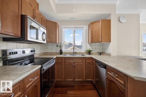 326 8528 82 Avenue, Edmonton, AB - Indoor Photo Showing Kitchen With Double Sink