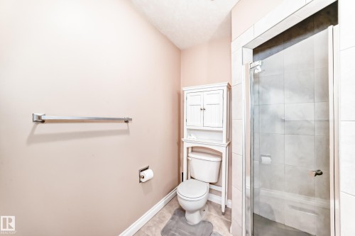 Bathroom featuring a standing shower with clear glass enclosure and tiled walls - 9110 180A Avenue, Edmonton, AB - Indoor Photo Showing Bathroom